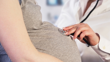 doctor examining pregnant women