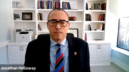 A photo of Rutgers President Holloway on a zoom call 