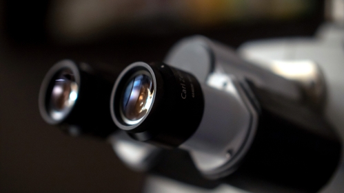 Closeup of a microscope eyepiece in a lab