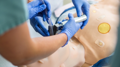 Medical students practice an intubation in a simulation lab