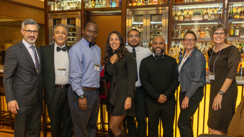 A group of Chancellor Awards ceremony attendees pose for a photo at the Rutgers Club.