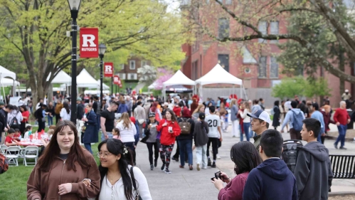 Students, faculty, alumni and community members walking around Voorhees Mall during Rutgers Day 2024.