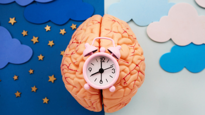 An illustration of the night sky with a yellow crescent moon and stars, and white clouds against a blue background.