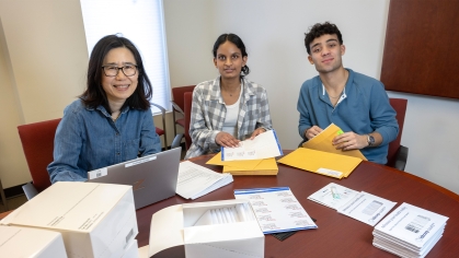 Students assemble and prepare distribution of home stool test kits at the Eric B. Chandler Health Center