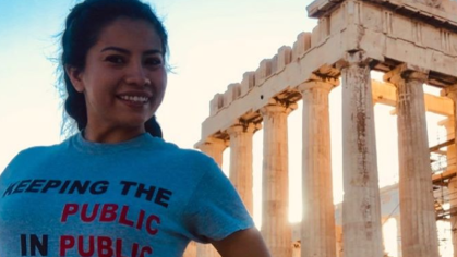 Public health student in front of the Parthenon