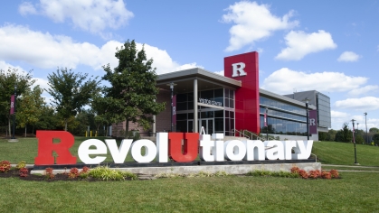 Revolutionary monument sits in front of the Visitor Center under a blue sky