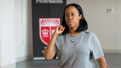 A health professions student exercises while wearing testing sensors for research