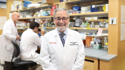 Chancellor Brian Strom stands in a lab