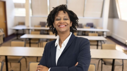 Sophia Jones stands in a classroom