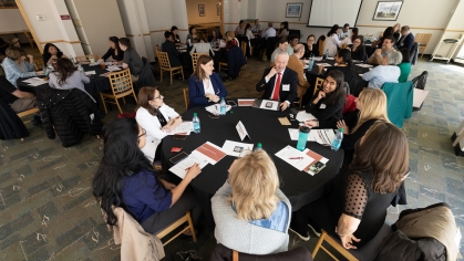 Students, faculty and staff from the medical schools talk at an integration summit