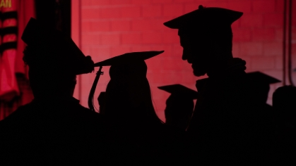  Silhouettes of graduates at commencement for Rutgers University–New Brunswick and Rutgers Health