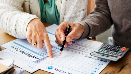 two people reviewing health insurance plans