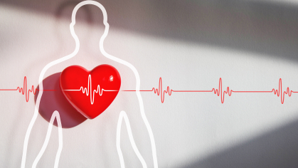 A red heart imposed over a sillouette of a person