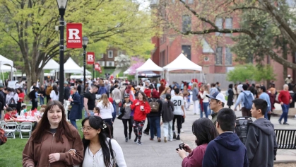Students, faculty, alumni and community members walking around Voorhees Mall during Rutgers Day 2024.