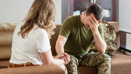 Sad Veteran with family member