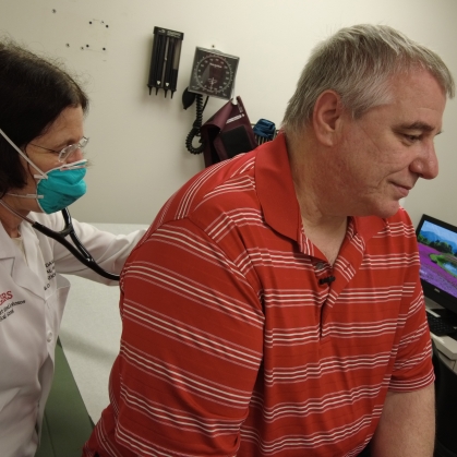 A doctor examines a patient