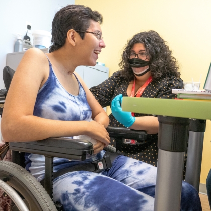 School of Health Professions students work with a patient