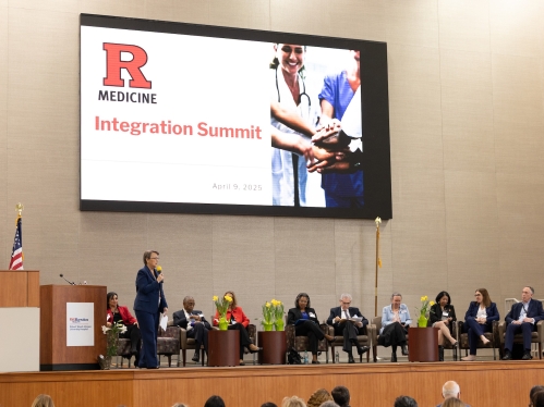 Dean Amy Murtha speaks on stage at the Integration Summit