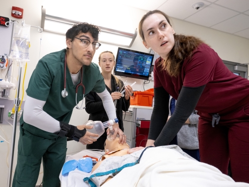 Medical students work together in a simulation lab