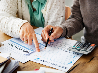 two people reviewing health insurance plans