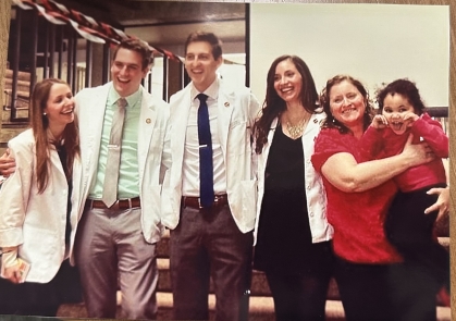 Joey poses at white coat ceremony