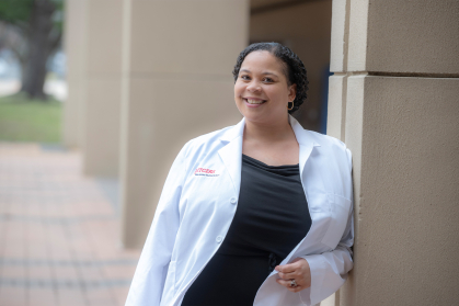Rachel Lee-Carey leaning against a wall outside