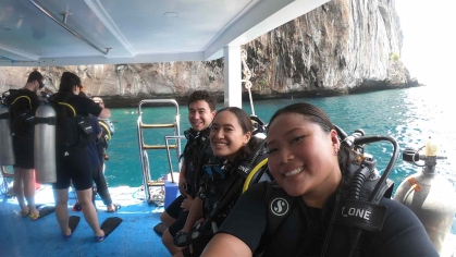 Rutgers medical student Erin Go (right) and other Fulbright recipients prepare to scuba dive off Koh Phi Phi.