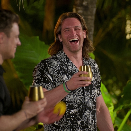 Joey holds wine glass