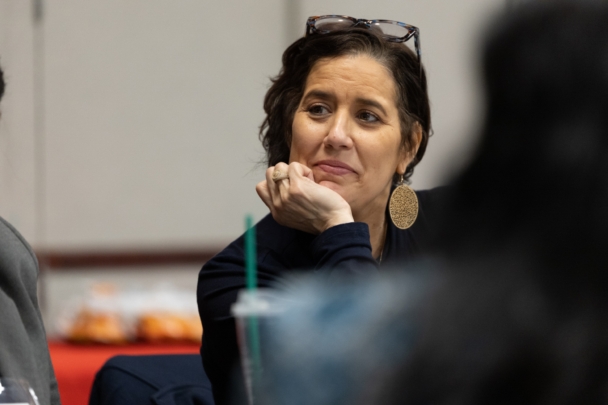 Attendees talk in groups at the integration summit.