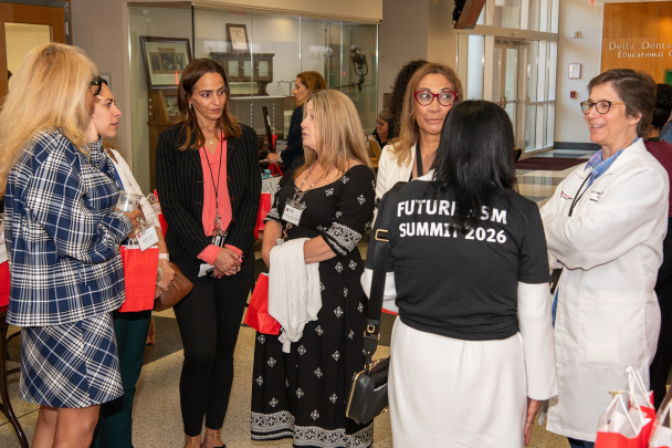 A group of attendees mingle and talk at the 2026 Integration Summit in Newark