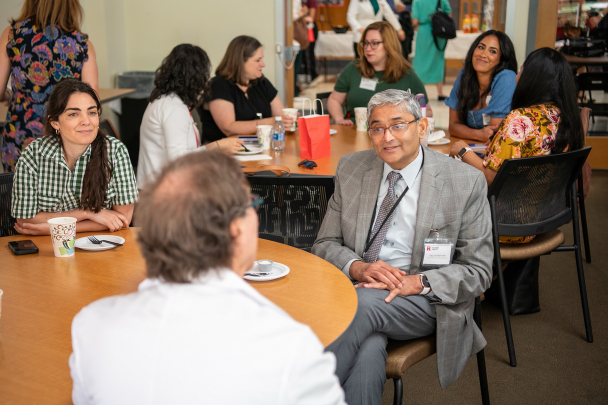 Attendees talk at the 2026 Integration Summit in Newark
