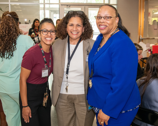 Three attendees pose for a photo at the 2026 Integration Summit in Newark