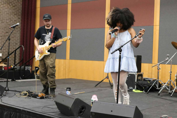 Rutgers alumni Josh Skoudis (left) and Izzy Nuñez, members of rock band Kouskous Heaven, perform in the College Avenue Student Center during Rutgers Day 2026.