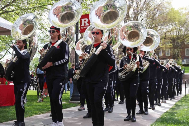 Members of the Scarlet Knights Marching Band perform on Voorhees Mall during Rutgers Day 2024.